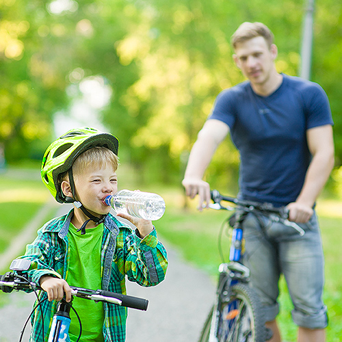 Boy drinking bottled water