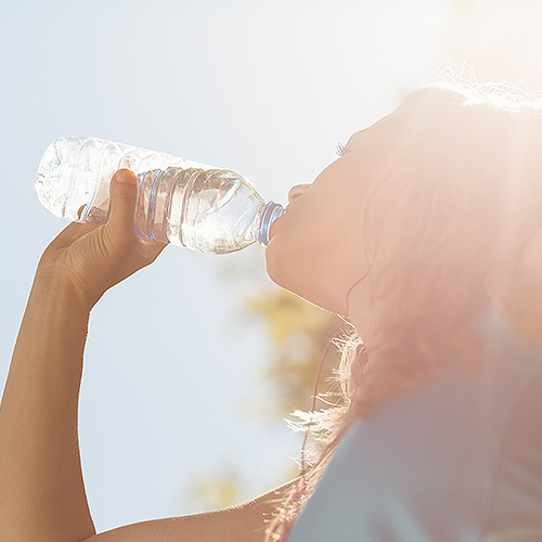 Woman drinking bottled water