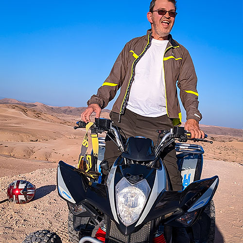 CNS patient rides ATV in Morrocco. 