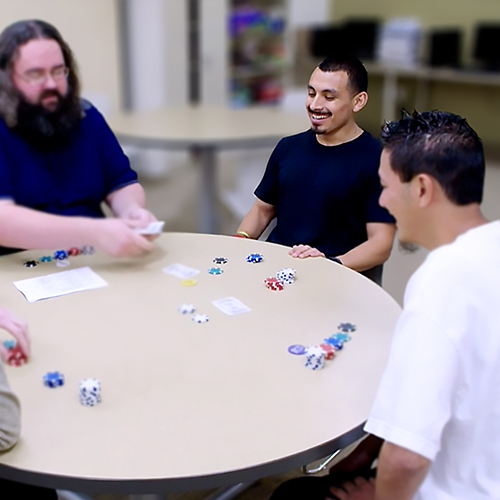 Therapist playing card game with patients.